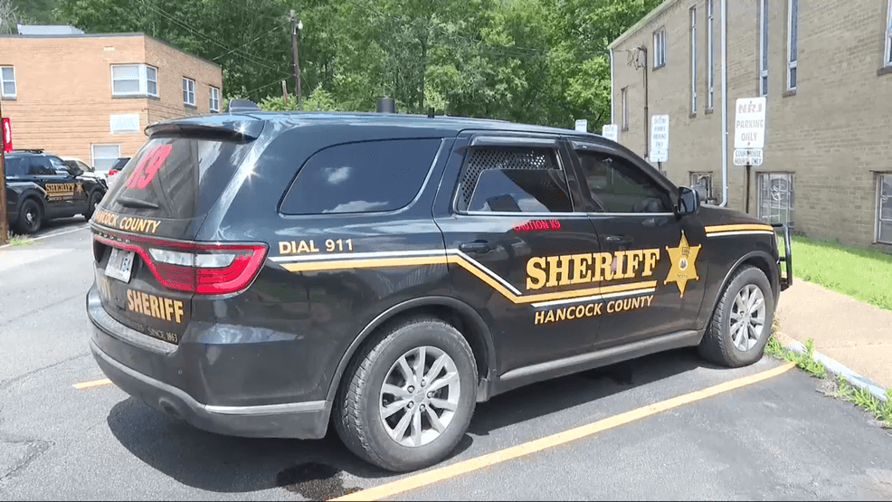 Hancock County Sheriff badge and patrol car